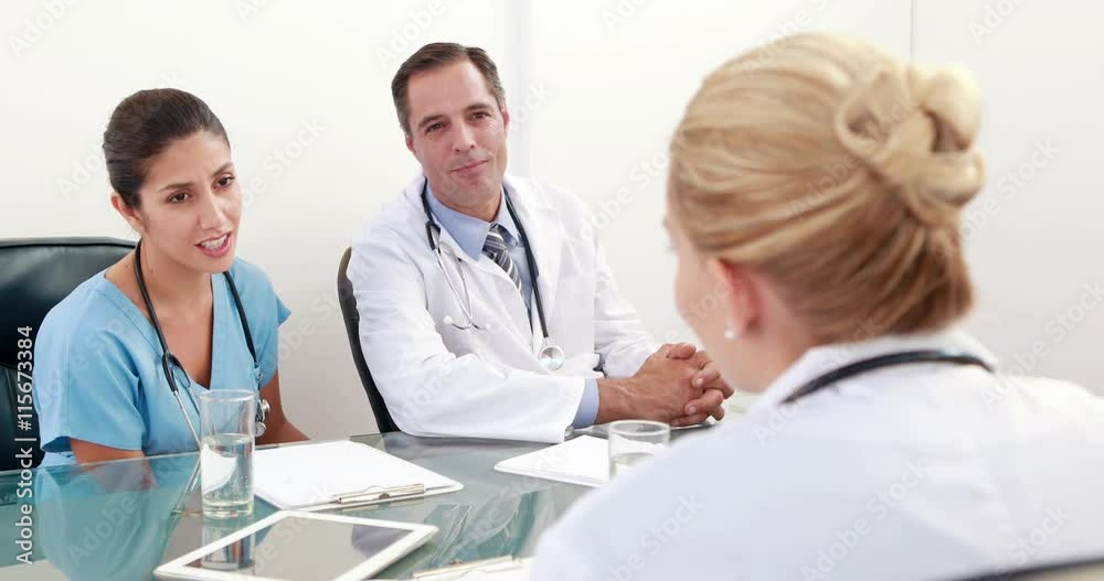 Video of medical team speaking together during meeting Video of medical team speaking together during meeting