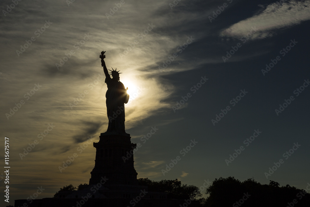 USA, New York, New York City, Silhouette of Statue of Liberty at sunset