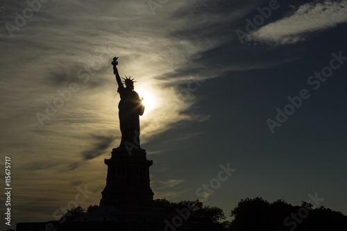 USA, New York, New York City, Silhouette of Statue of Liberty at sunset