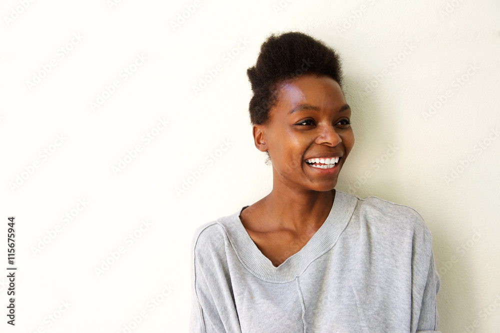 Happy young afro american lady looking away and smiling Happy young afro american lady looking away and smiling