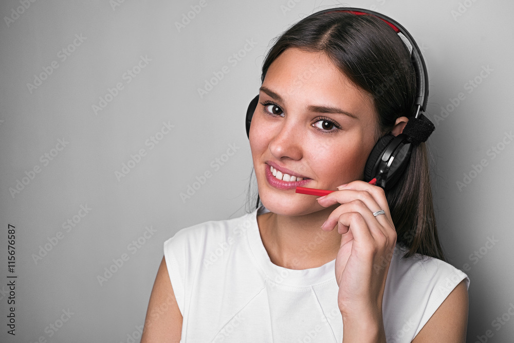 Smiling call centre operator in headphones with mic Smiling call centre operator in headphones with mic