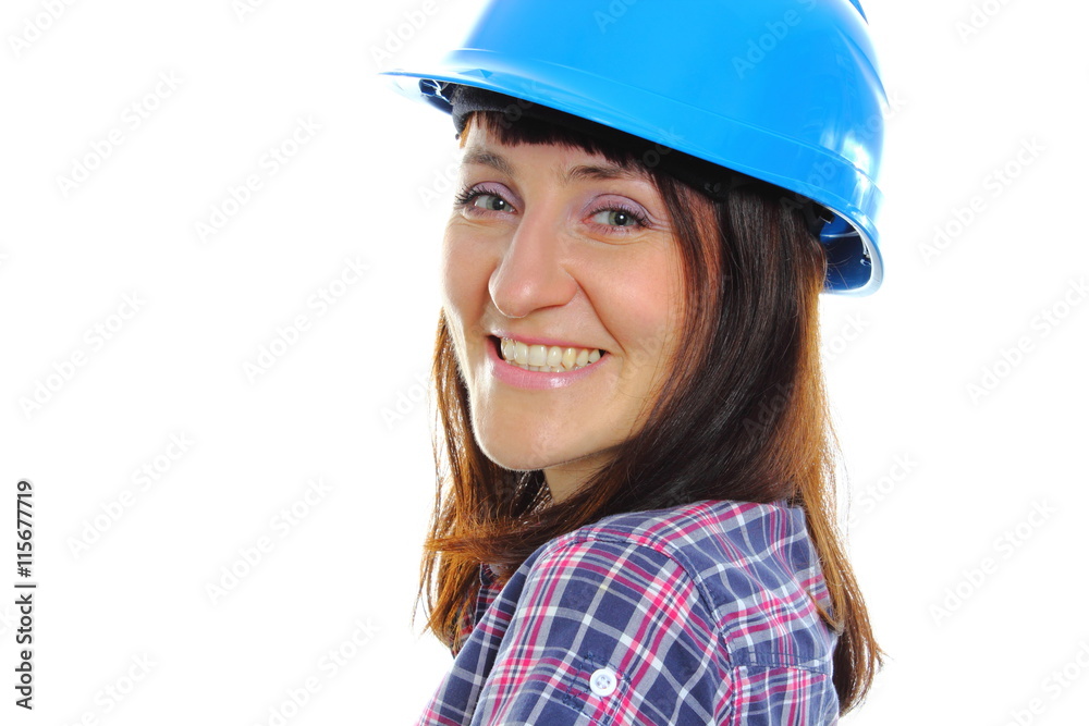 Smiling builder woman wearing protective blue helmet Smiling builder woman wearing protective blue helmet