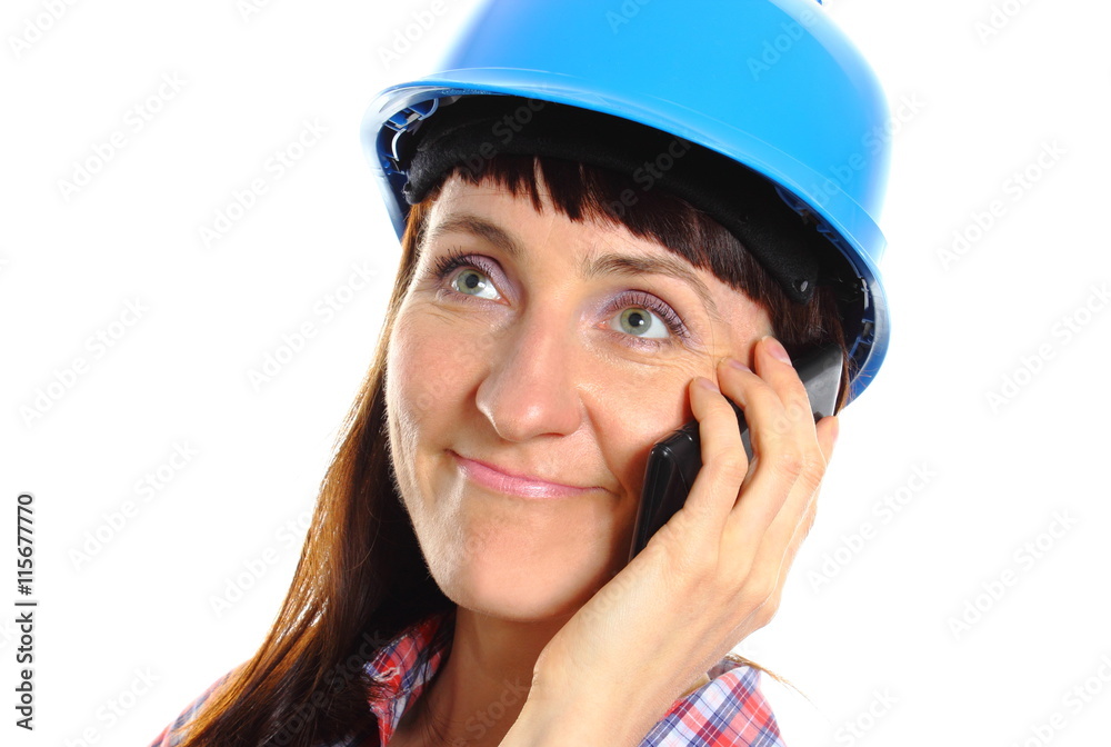Builder woman in protective helmet talking on mobile phone Builder woman in protective helmet talking on mobile phone
