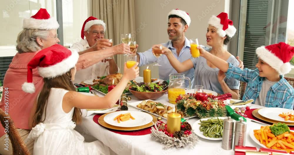 Happy extended family at the christmas dinner table Happy extended family at the christmas dinner table