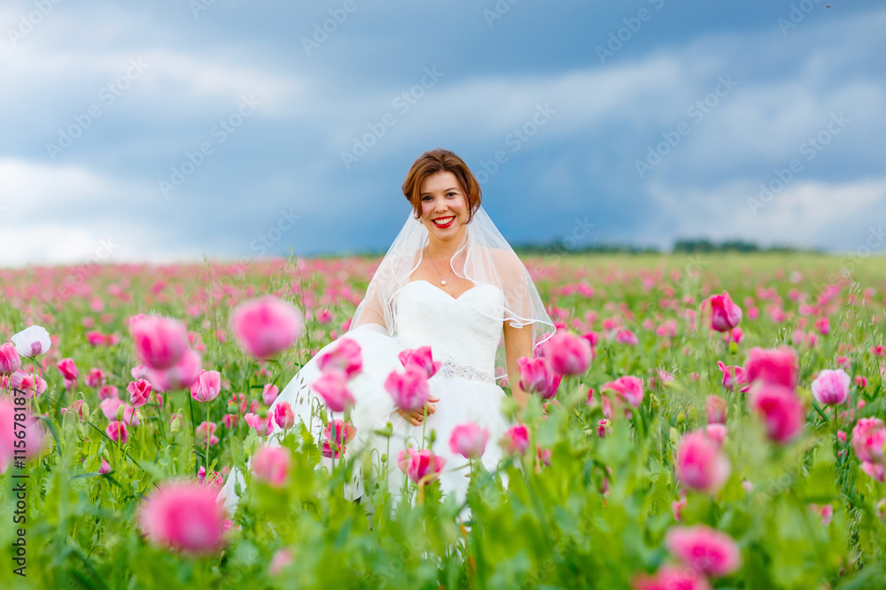 happy bride in white dress having fun in flower poppy field happy bride in white dress having fun in flower poppy field