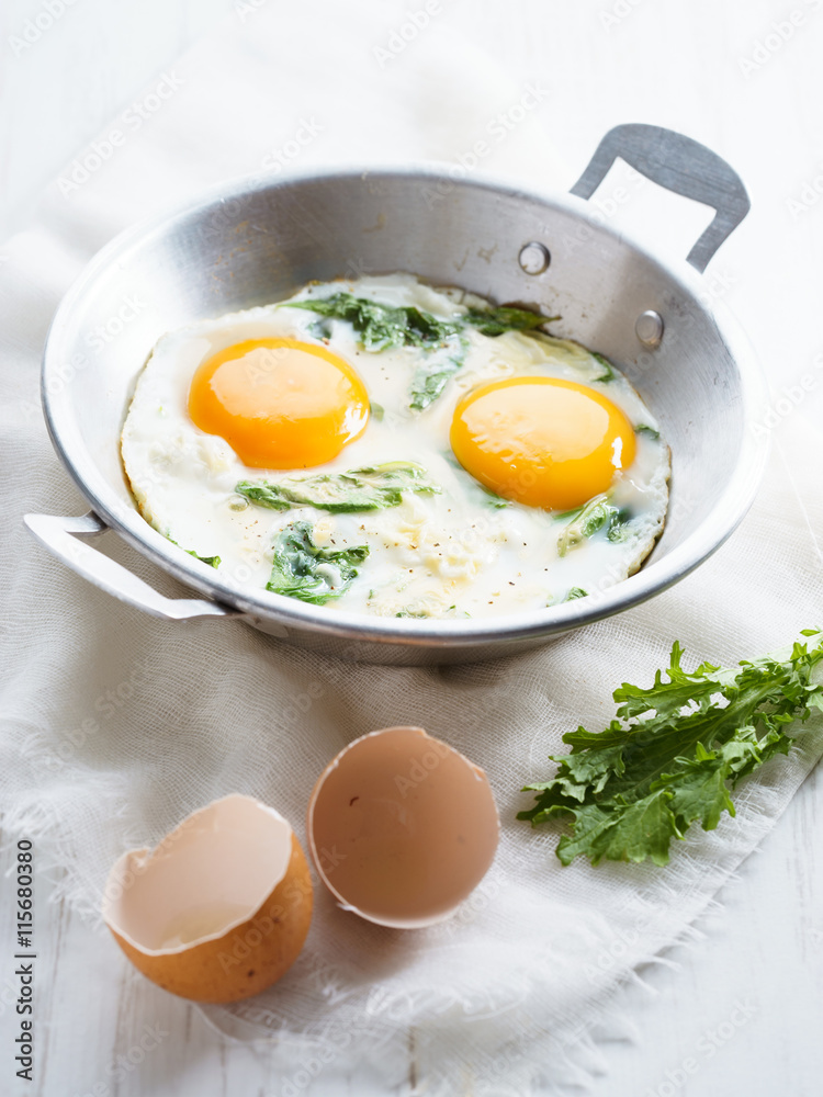 fried egg with green spinach fried egg with green spinach