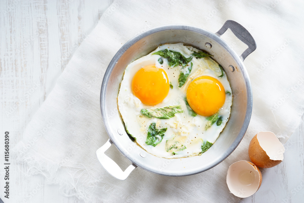 fried egg with green spinach