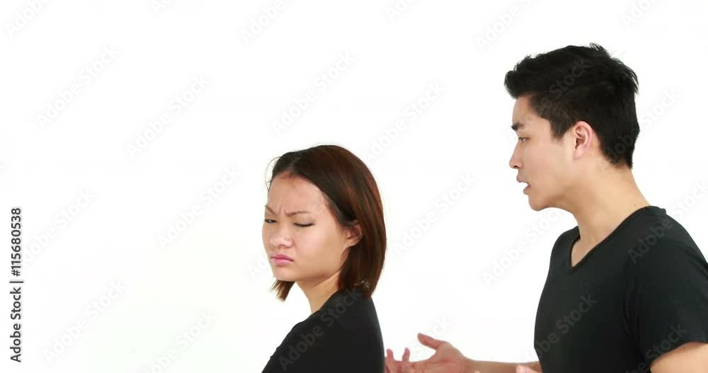 Young couple having an argument on white background Young couple having an argument on white background