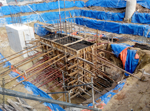 Pile cap form work with reinforcement bar in it and the excavated pile at construction site in Johor, Malaysia. 
