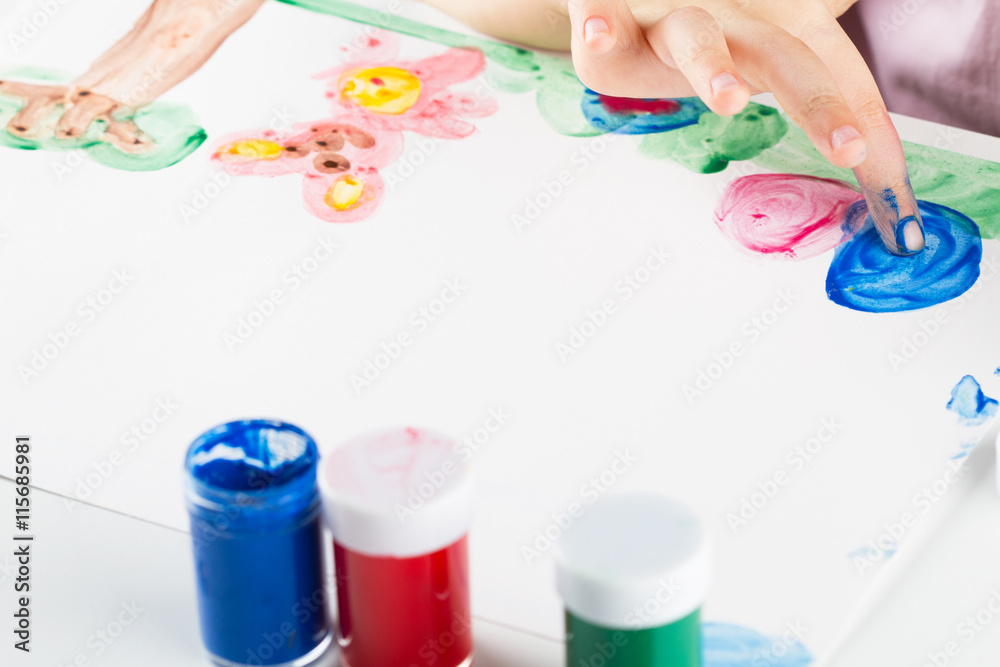 Child paiting the paint with your fingers Child paiting the paint with your fingers