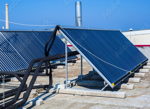 Vacuum solar cells for water heating system on the pool roof