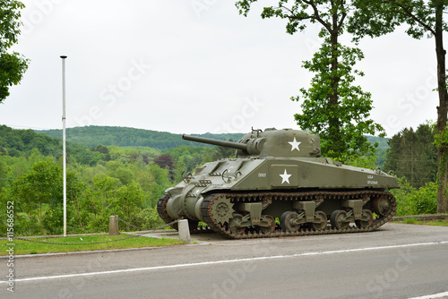 Sherman tank monument in Belgium Ardennes on the river Maas photo