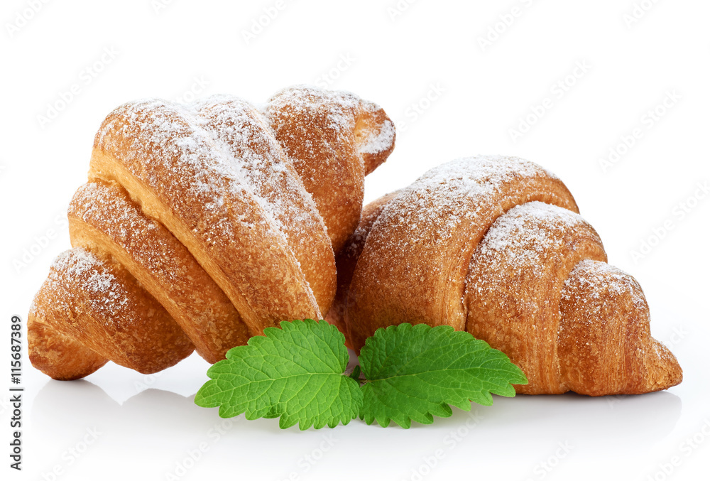 Croissant covered with sugar powder, isolated on a white backgro