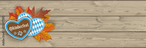 Oktoberfest - Header mit Lebkuchen, Herbstlaub und Holzbrettern