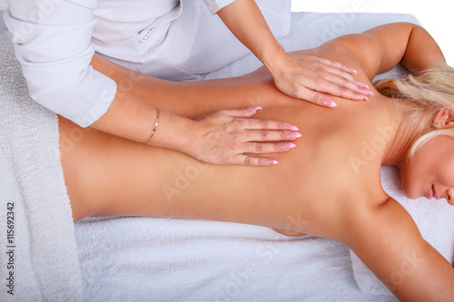 Female enjoing relaxing back massage.