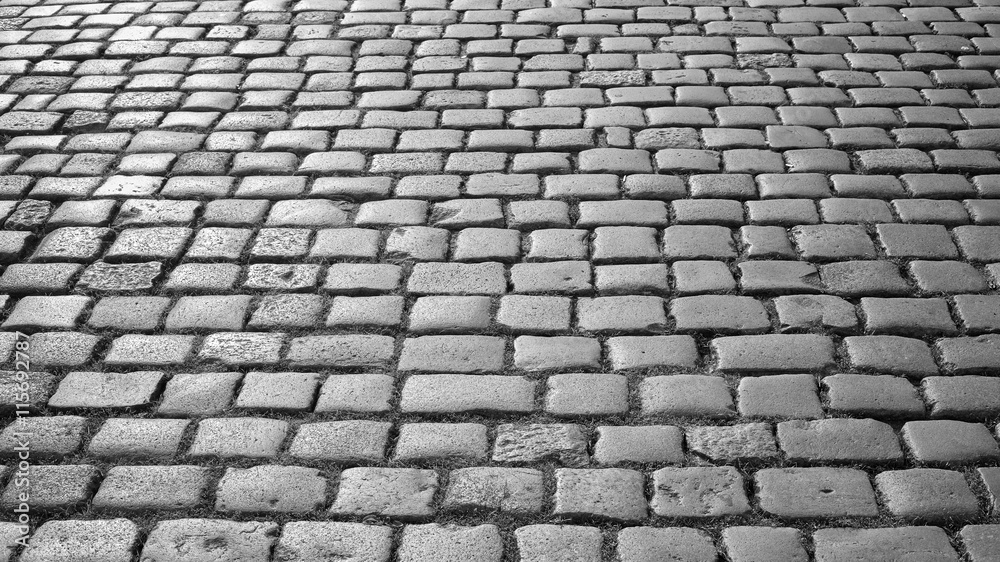 Black and white photo of cobblestone pavement