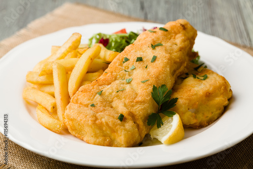Photography Fried cod with chips.