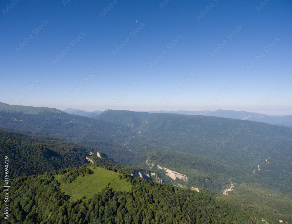 Aerial photos. The mountain ridge covered  forest. Mountain land