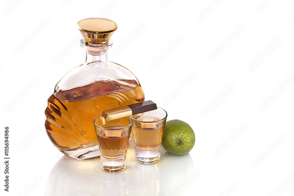 Bottle with glasses tequila and lime on white background Bottle with glasses tequila and lime on white background