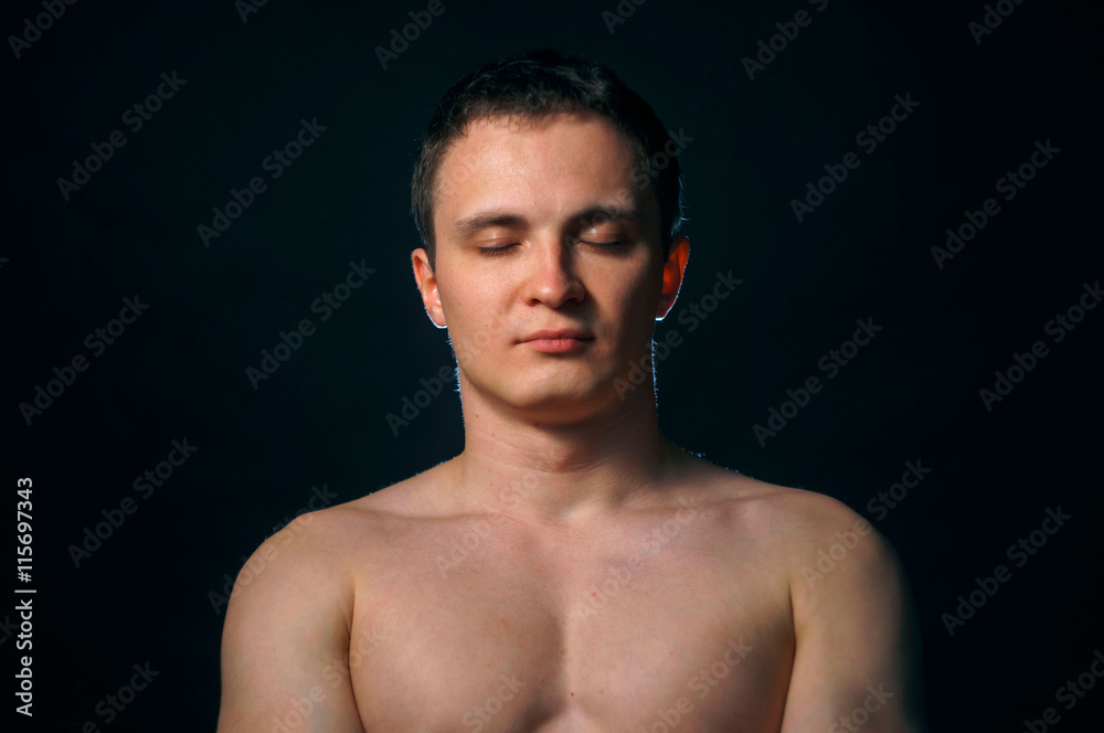 portrait of topless athletic man posing over black background portrait of topless athletic man posing over black background
