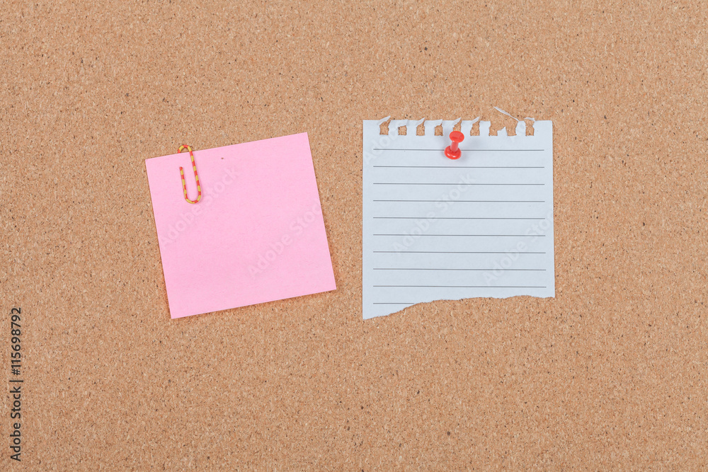Note paper with pin on the cork board Note paper with pin on the cork board