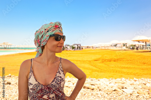  woman on a beach of dead sea
