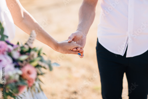a bouquet of flowers in their hands