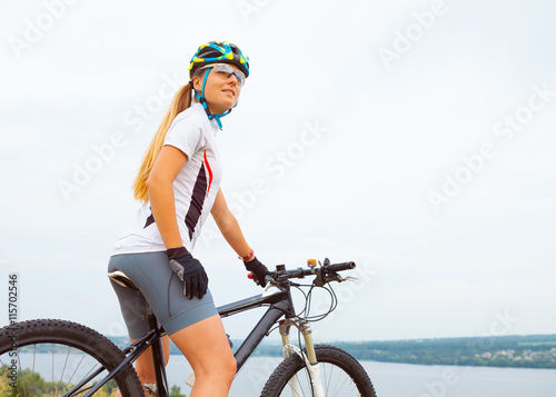 Young girl riding bicycle outside. Healthy Lifestyle.