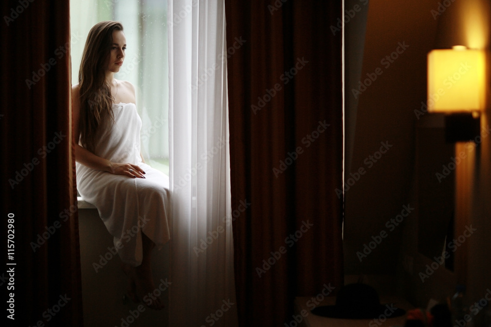 glamor portrait of a girl hotel window glamor portrait of a girl hotel window
