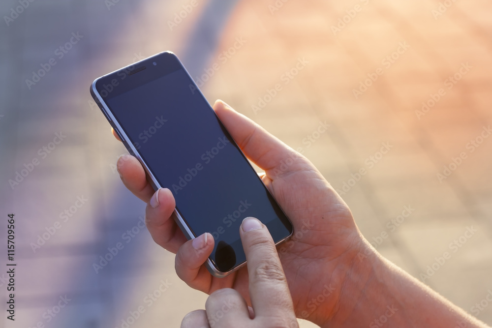 Woman hand holding contemporary modern smartphone. Visual effects. .Vertical mockup