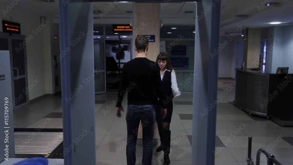 When passing through metal detector lights up red, inspection of men. When passing through metal detector lights up red, inspection of men.