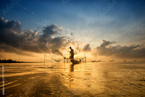 Landscape of Pakpra with fisherman in sunrise at Phatthalung, Th