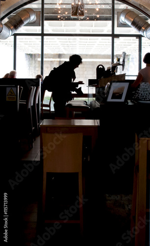 People silhouette inside a pub © EyeMFlatBoard