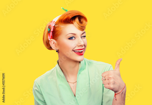 Pin up girl showing like sign gesture