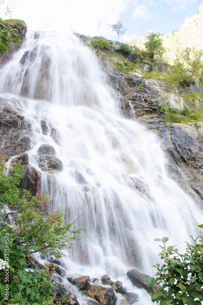 Fototapeta premium Beautiful waterfall in the Italian mountains Alps