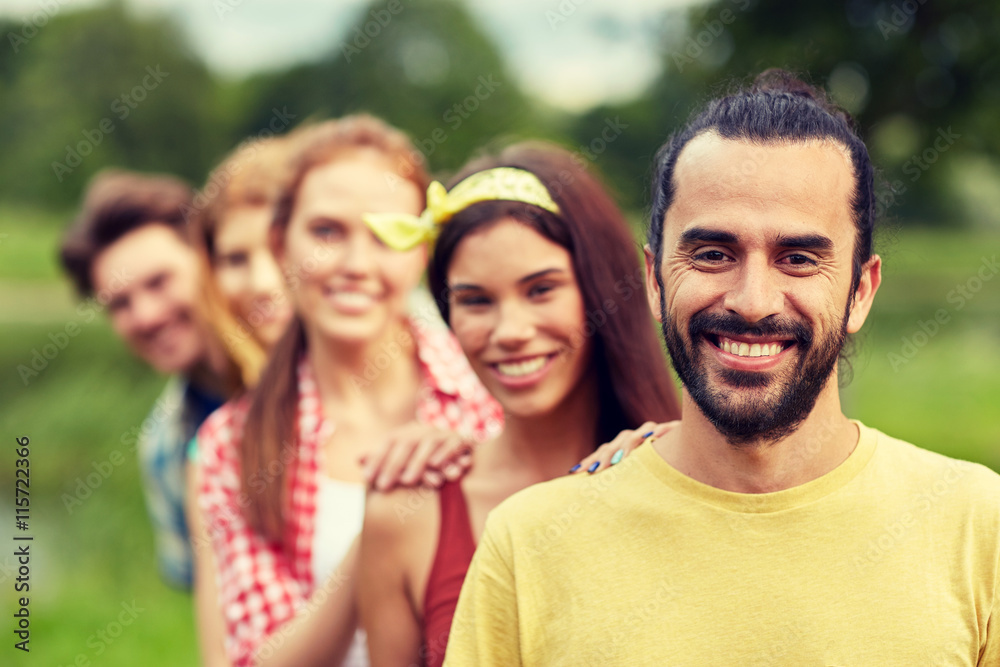 group of smiling friends outdoors