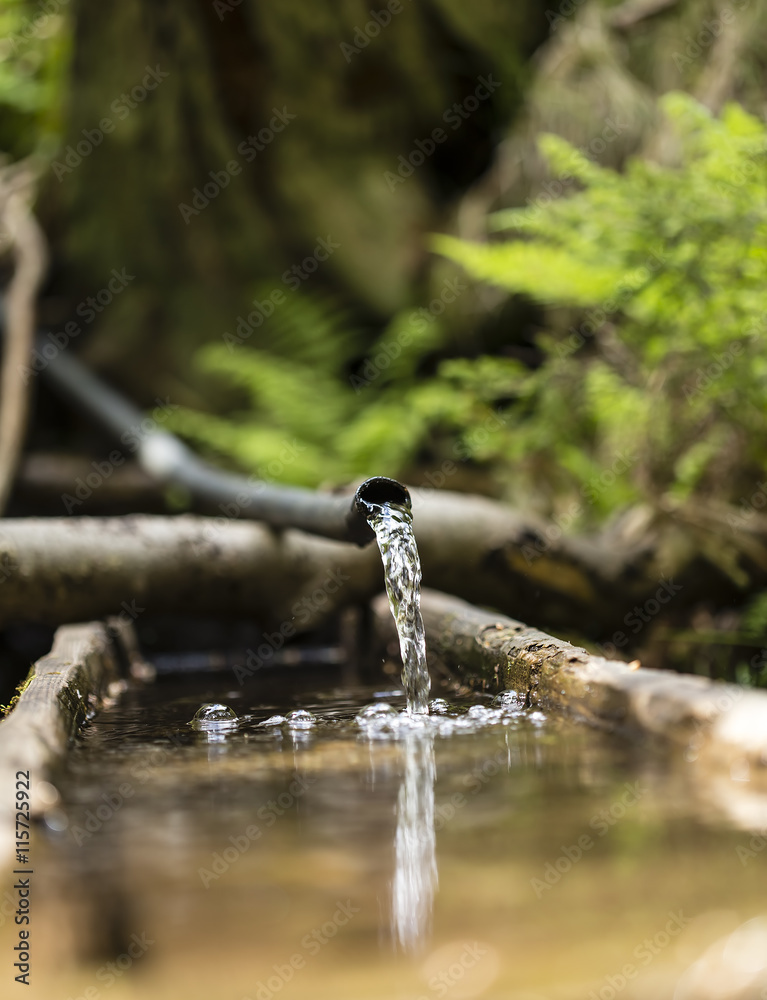 Obraz premium Water from a plastic pipe