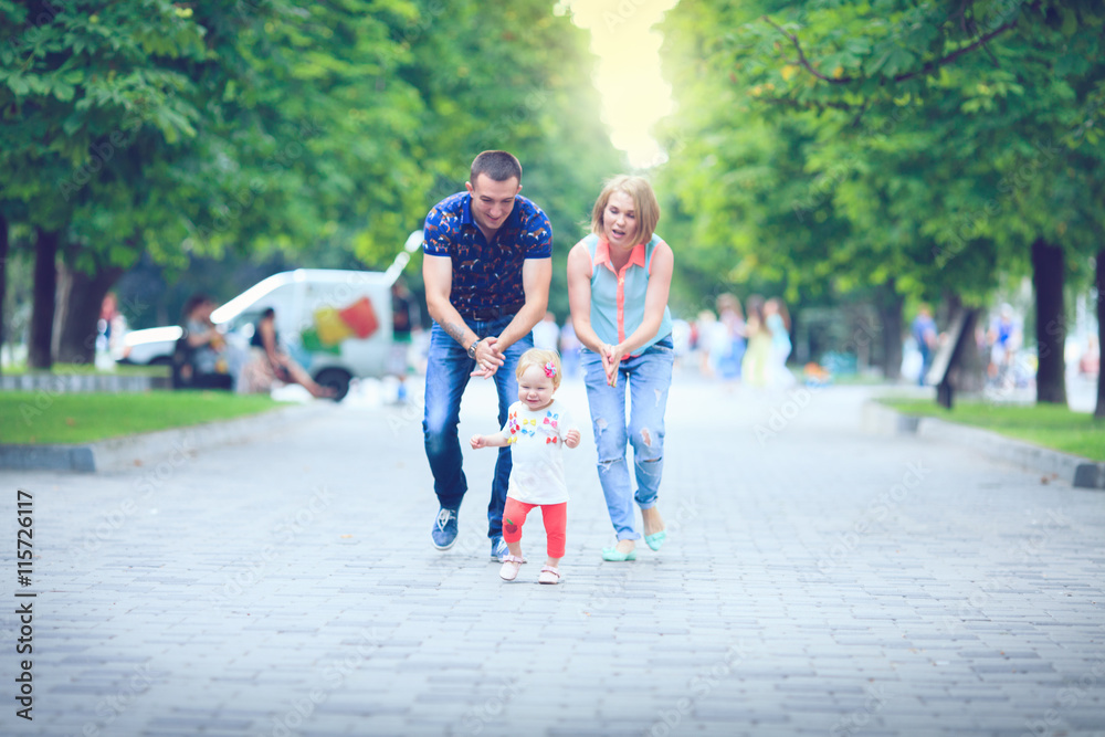 Happy family having weekend in summer park Happy family having weekend in summer park