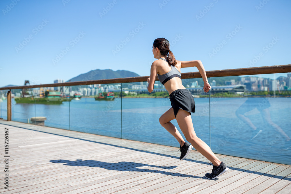 Woman running in a city Woman running in a city