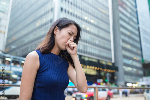 Woman cough at outdoor © leungchopan
