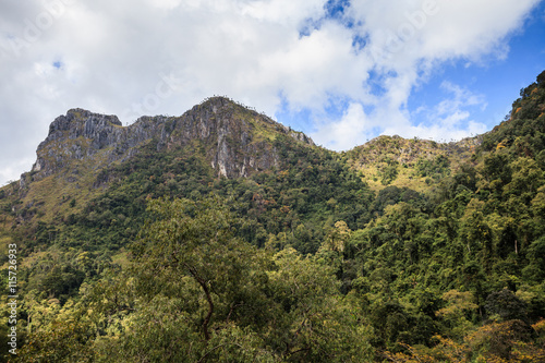 mountain peak and raining fog blue sky