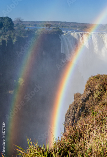 Fototapeta Victoria Falls. A general view with a rainbow. National park. Mosi-oa-Tunya National park. and World Heritage Site. Zambiya. Zimbabwe. An excellent illustration.