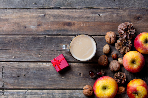 apples, fir-cones, cup of coffee, gift and nuts