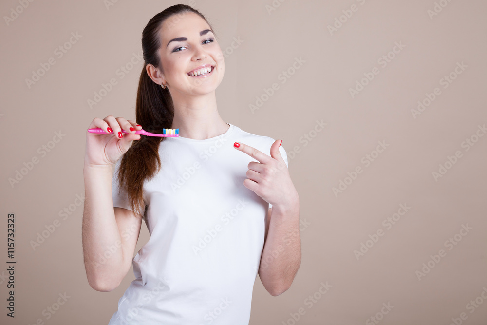 beautiful girl holding a toothbrush beautiful girl holding a toothbrush