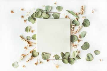 white wedding or family photo album, frame with dry and fresh branches isolated on white background. flat lay, overhead view