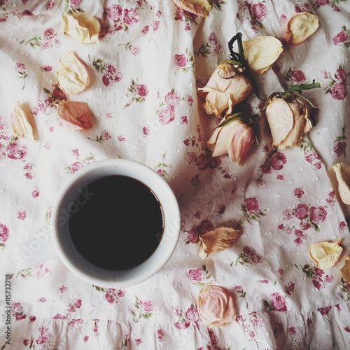 Cup of coffee and roses
