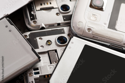 Photography Disassembled cell phone with visible parts inside