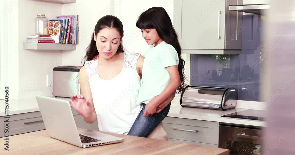Mother and her daughter using laptop Mother and her daughter using laptop