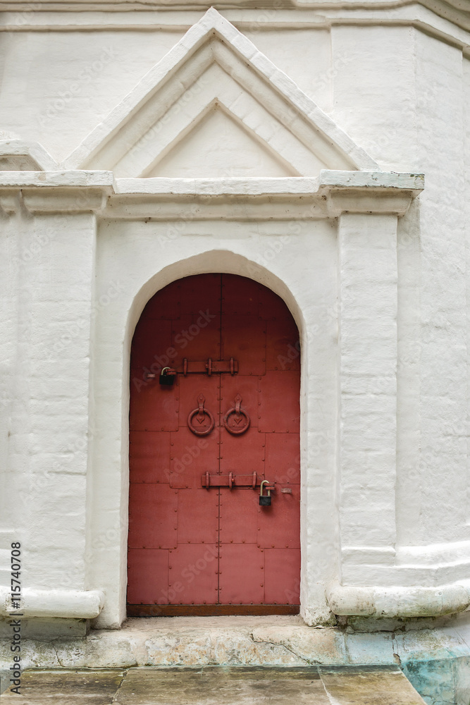 Porch with old door with rings and locks Porch with old door with rings and locks