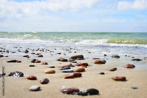 Colorful stones on sand beach